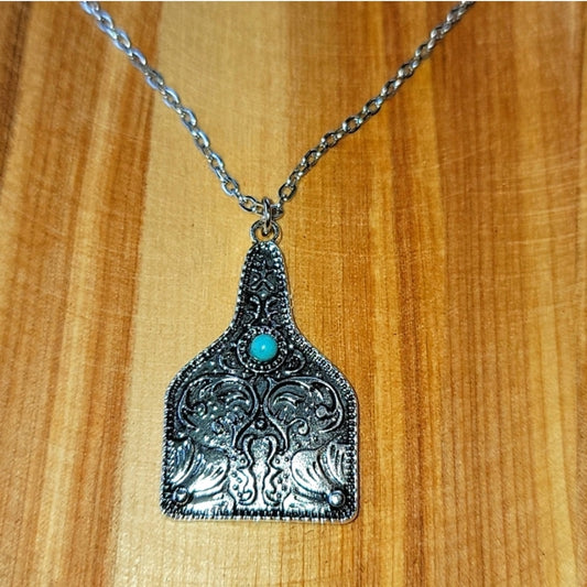 Turquoise Scrolled Cow Tag Silvertone Necklace